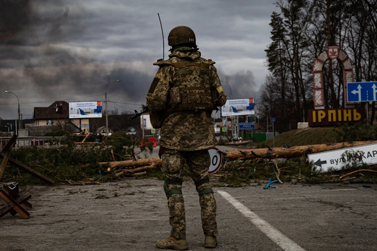 Ukrainian soldier at a checkpoint at Irpin.