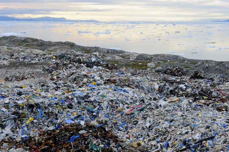 A massive dump with the Arctic ocean in the background.