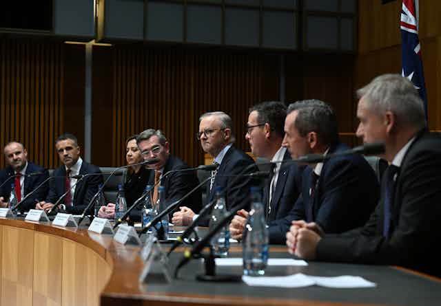 Prime Minister Anthony Albanese at a curved desk with the nation's premiers and chief ministers at the National Cabinet meeting.