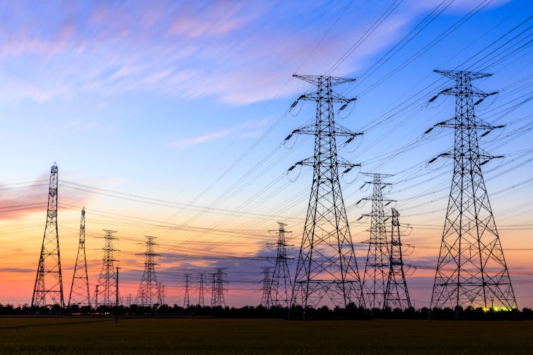 Transmission towers at sunset