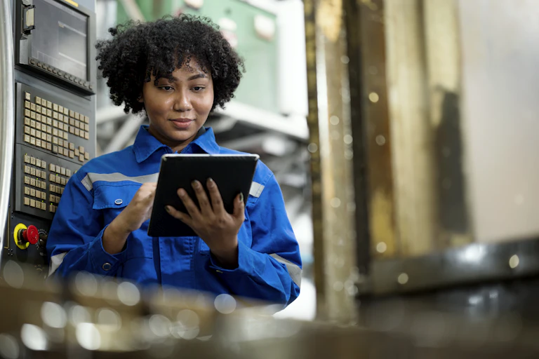 Woman typing on an iPad