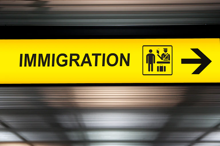 Yellow airport sign for immigration