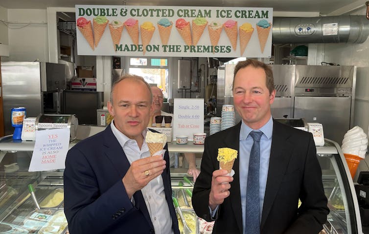 Liberal Democrats Ed Davey and Richard Foord eating ice creams at a local shop in Devon.