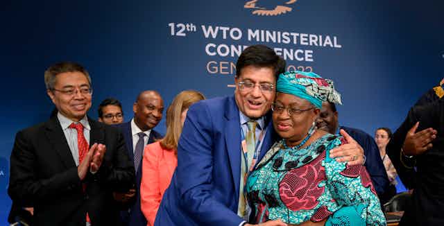 World Trade Organization director-general Ngozi Okonjo-Iweala, right, is congratulated by India's minister of commerce Piyush Goyal at the end of the WTO Ministerial Conference on June 17 2022.