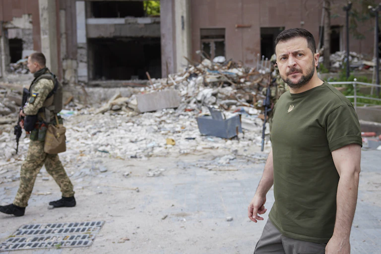 Ukrainian President Volodymyr Zelenskyy walking in war-torn area of Mykolaiv
