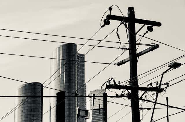 electricity poles and city skyline