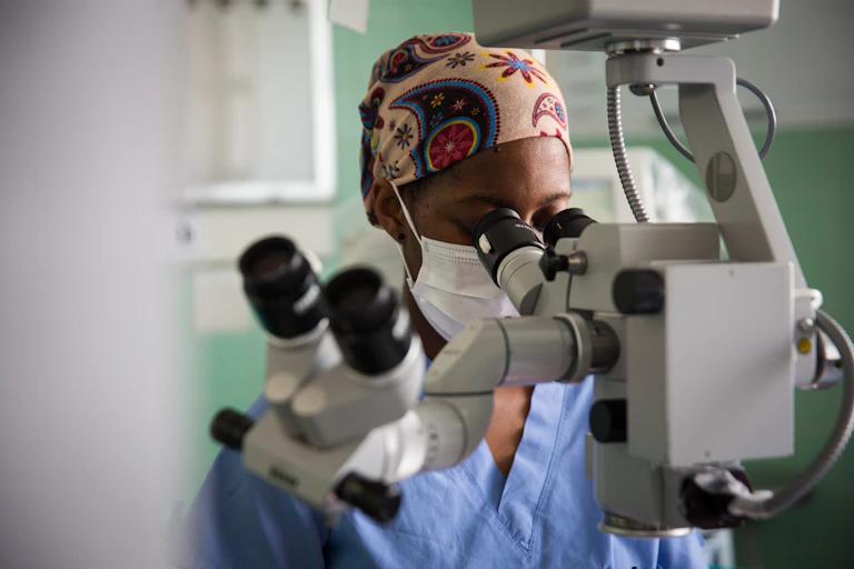 Women looking through a microscope