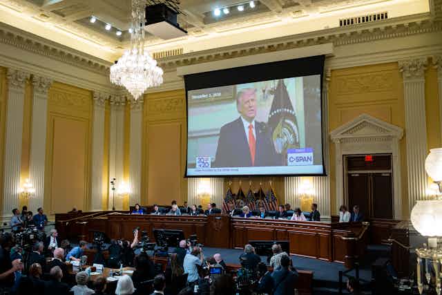 Former US President Donald Trump, is displayed on a screen, during a public hearing of the House Select Committee to Investigate the January 6th Attack on the US Capitol