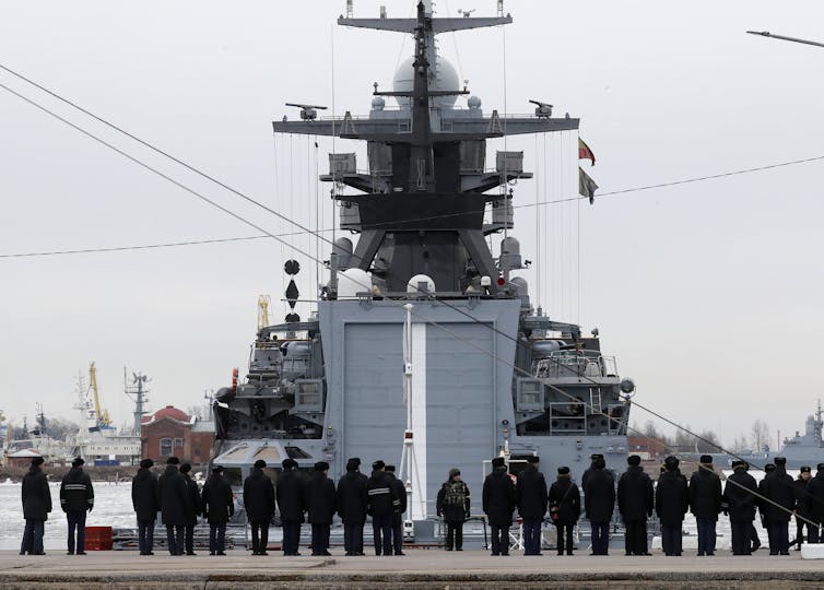 Russian Navy sailors stand in front of a naval ship in Kronstadt, near Saint Petersburg, Russia, on April 14, 2022.