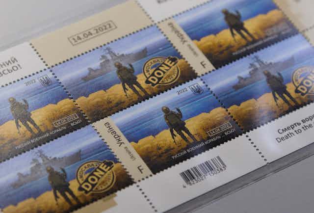 Postage stamps depicting a Ukrainian soldier making a hand gesture at a Russian warship off Snake Island.