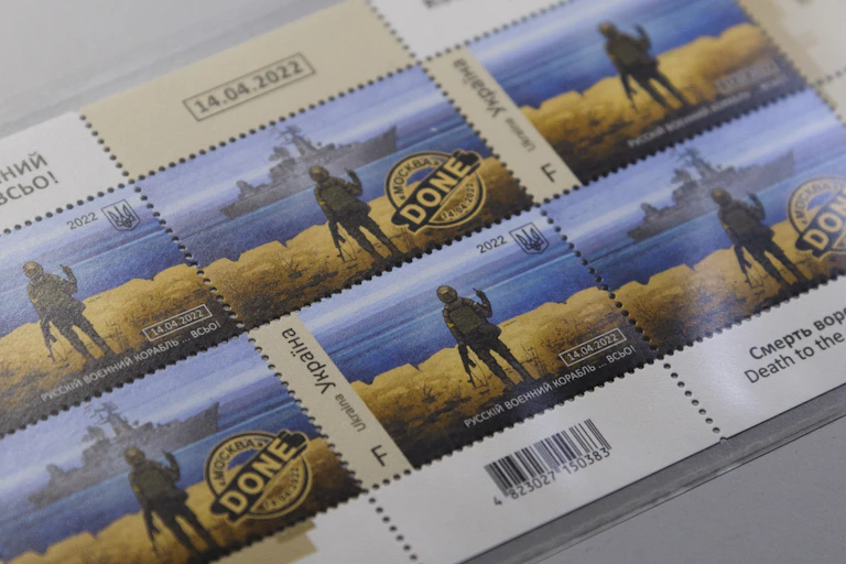 Postage stamps depicting a Ukrainian soldier making a hand gesture at a Russian warship off Snake Island.
