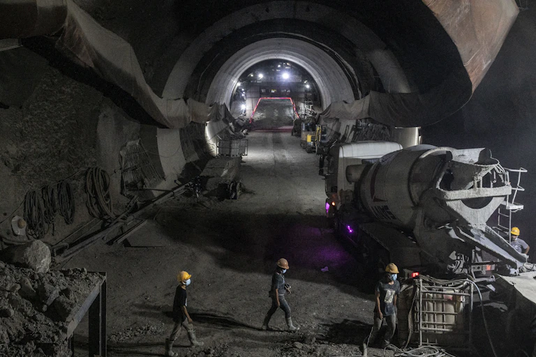 Construction workers work on the tunnel for the Jakarta-Bandung High-Speed Train (KCJB).