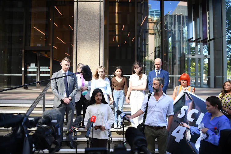 Anjali Sharma speaks to the media outside the NSW Federal Court with other kids behind her