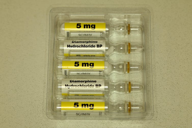 Five 5 mg vials of diamorphine wrapped in plastic.