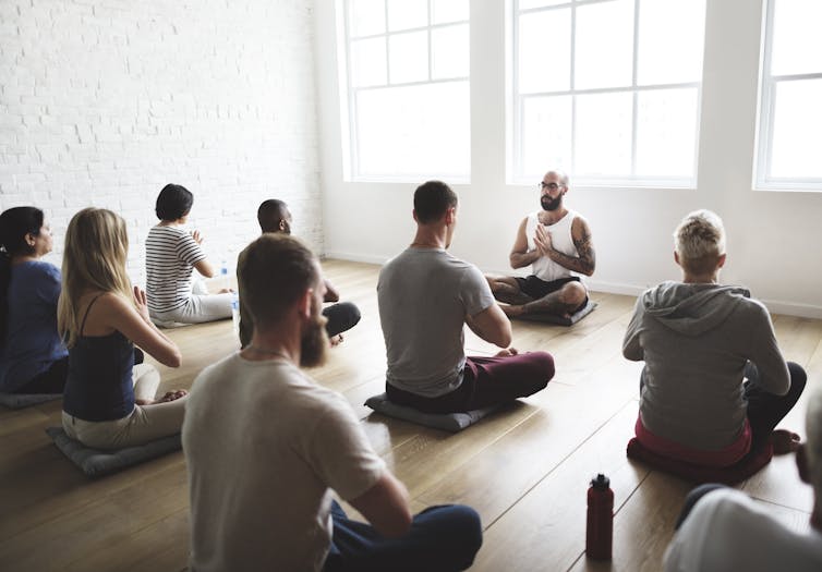 People meditating in a class