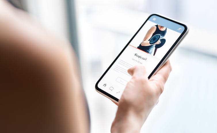 Phone screen showing a weight and bicep curl