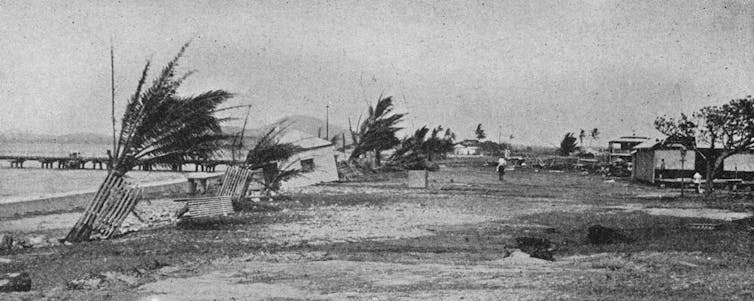 Black and white image of beach hit by big winds