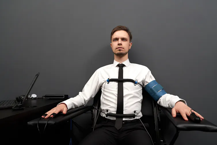 Man taking a lie detector test.