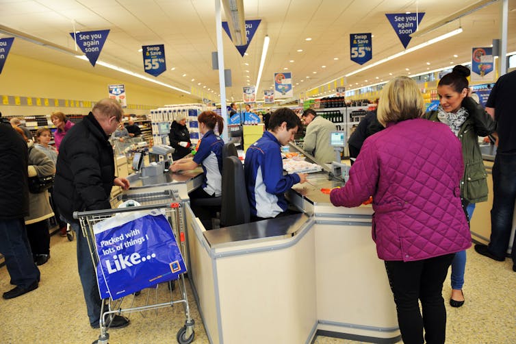 Shoppers and staff around an Aldi checkout in Leeds