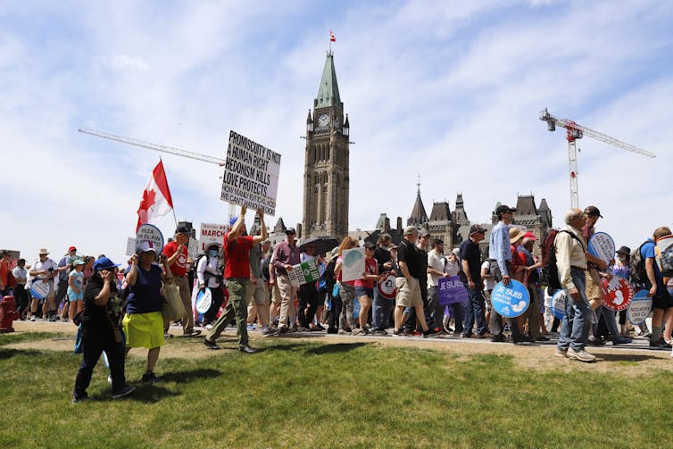 The Canadian Parliament Buildings can be seen as anti-abortion advocates march on Parliament Hill.