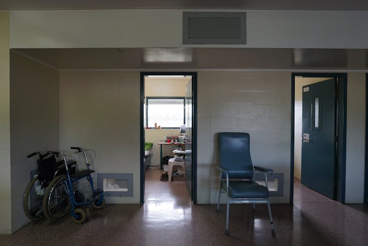 prison cell doorways with wheelchairs outside