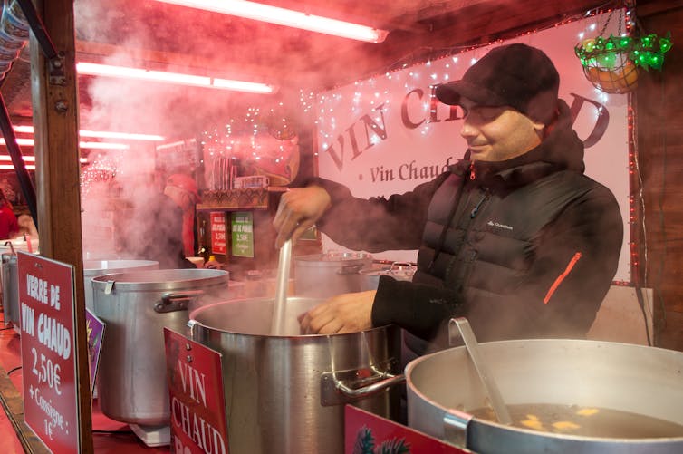 A man serves mulled wine