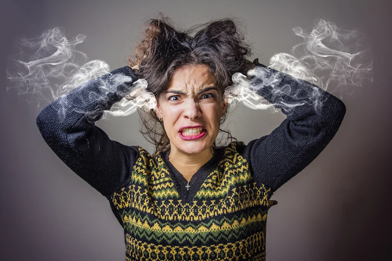 Image of a frustrated woman literally steaming with rage