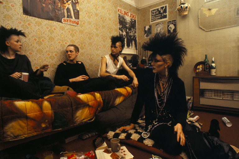 A group of punks in a bedroom.