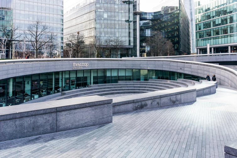 A stone-tiled public space in an office development.