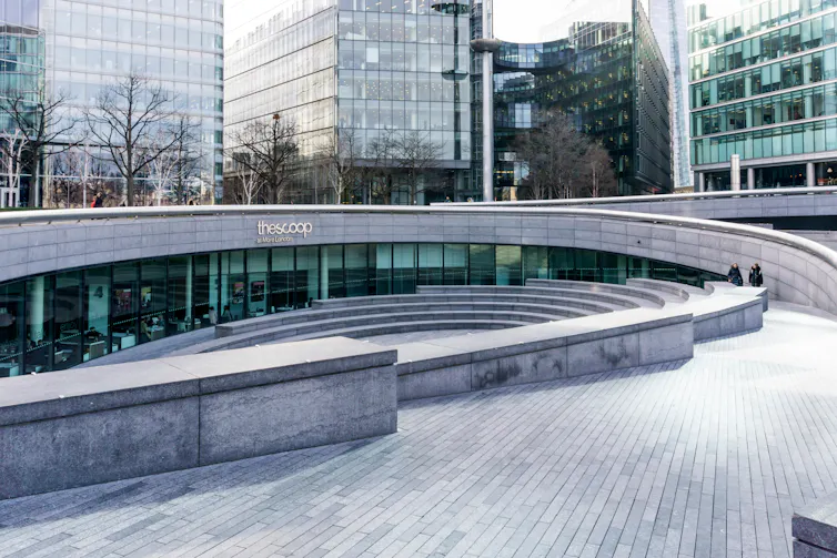A stone-tiled public space in an office development.