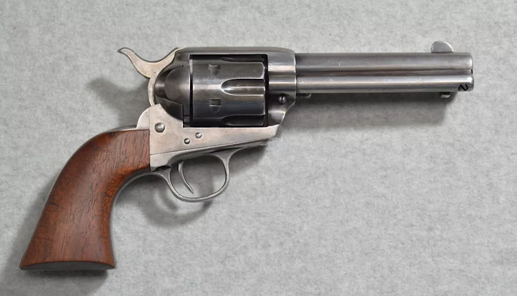 A revolver with a wooden barrel
