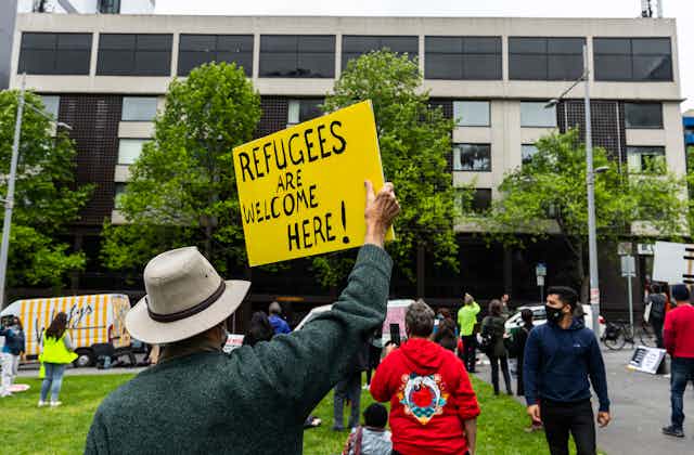 Refugee advocate holding a placard