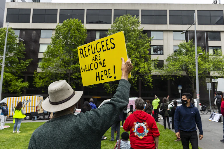 Refugee advocate holding a placard