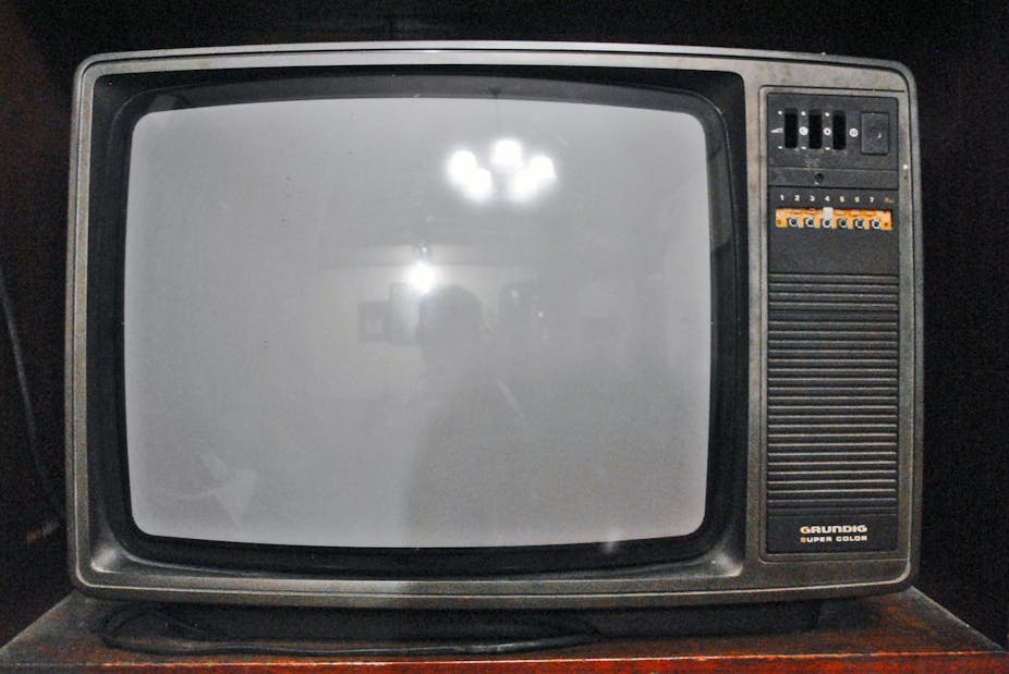 Old television with a blank screen.