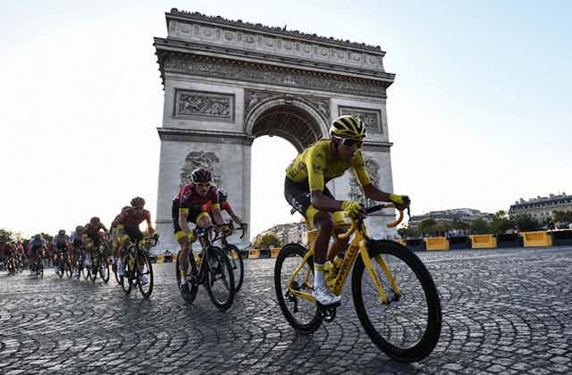 Cyclists by the Arc de Triomphe in Paris.
