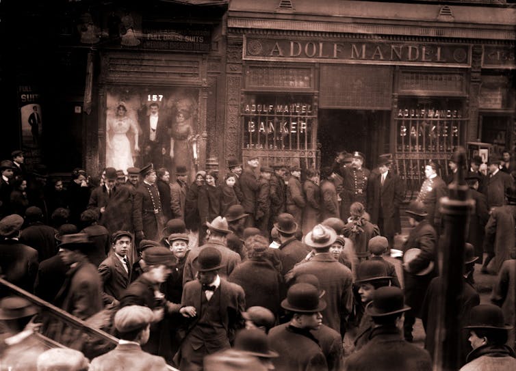 Police keep order during a run on the Adolf Mandel Bank in New York City, February 16 1912.