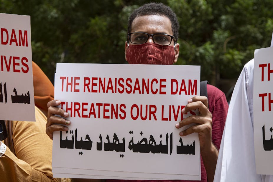 Sudanese demonstrators holding placards and banners gather to protest against Italian company, which undertook the construction of the Hidase Dam known as the Grand Ethiopia Renaissance Dam (GERD), on the Nile River.