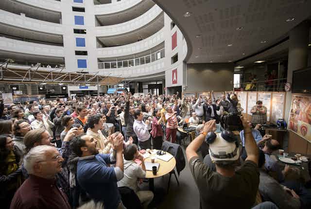 Image from press conference for the announcement of the Higgs boson discovery.