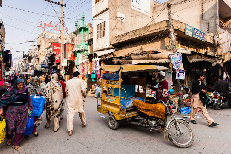 Men and women in a Pakistan street.