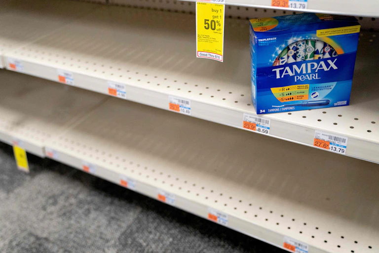 Grocery shop shelves are empy save for one box of Tampax