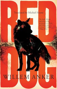 A book cover with a graphic of a wild dog and large red letters behind the inscription 'Red Dog'