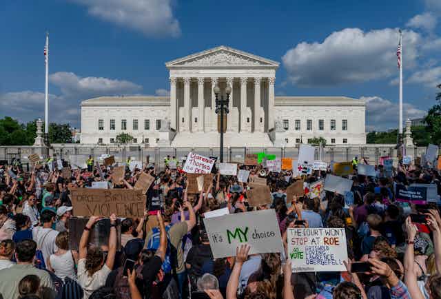 Protestors gather outside the US Supreme Court