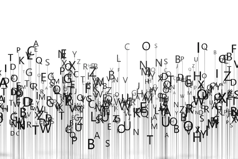 An illustration of letters from the English alphabet sliding down the page.