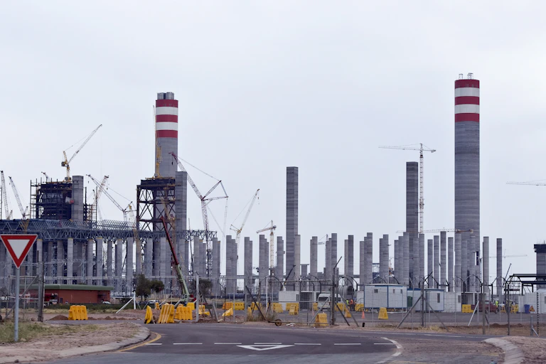 Construction site with pillars and cranes