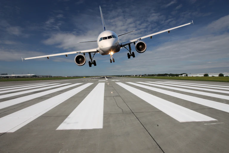 A plane lands on a runway
