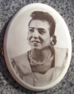 Black woman in an oval gravestone picture from 1930.