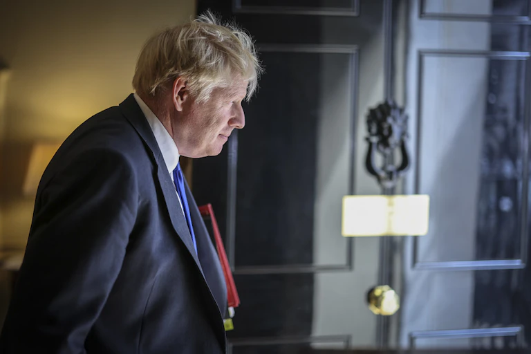 Boris Johnson walking out of 10 Downing Street.