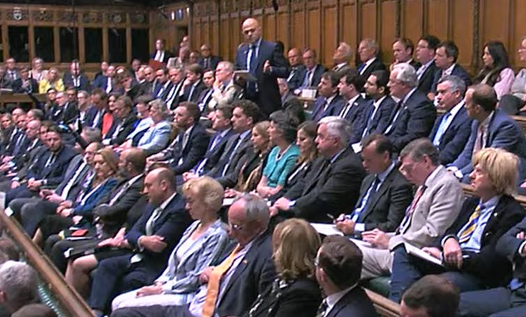 Sajid Javid standing up in parliament giving a speech.