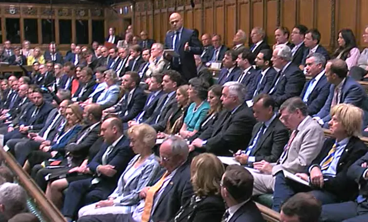 Sajid Javid standing up in parliament giving a speech.