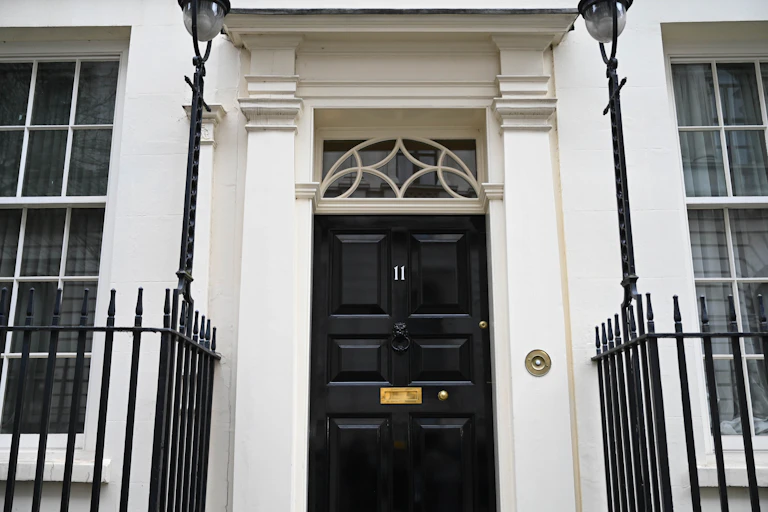 Black front door of 11 Downing Street, London
